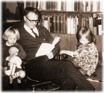 Reading with his daughters